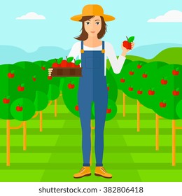 Agricultor recogiendo manzanas.