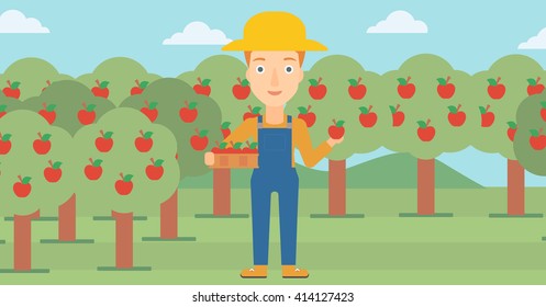 Agricultor recogiendo manzanas.