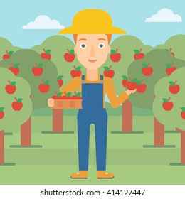 Farmer collecting apples.