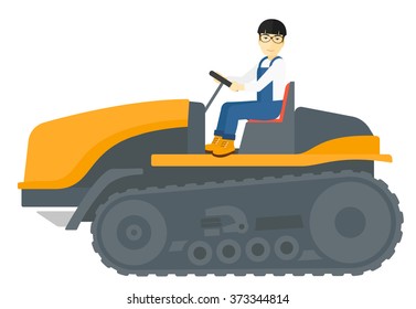 Farmer driving catepillar tractor.