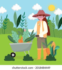 farmer girl with carrots in the wheelbarrow