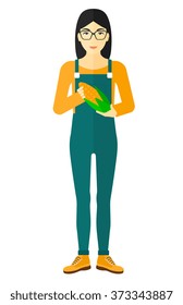 Farmer holding corn.