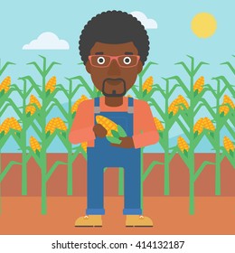 Farmer holding corn.