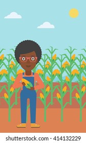 Farmer holding corn.