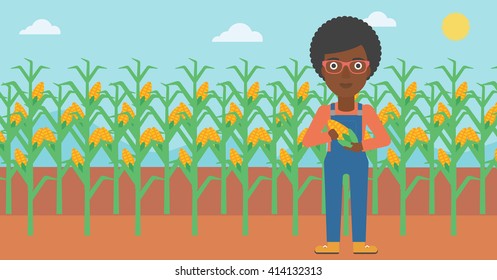 Farmer holding corn.