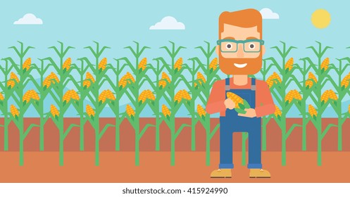 Farmer holding corn.