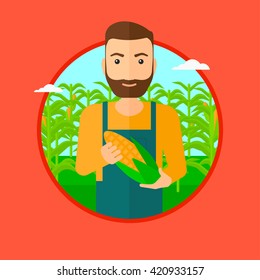 Farmer holding corn.