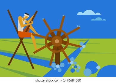 Farmer irrigates a paddy field using traditional water wheel