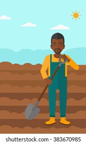Farmer on the field with shovel.