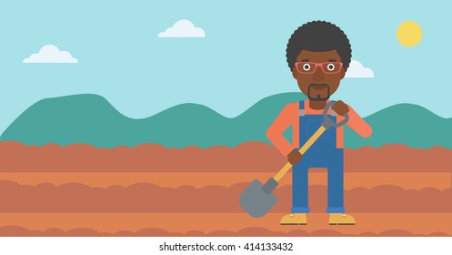 Farmer on the field with shovel.