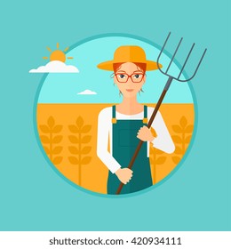 Farmer with pitchfork in wheat field.