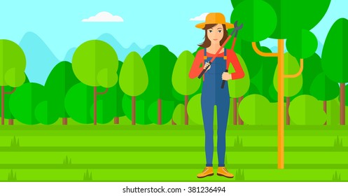 Farmer with pruner in garden.