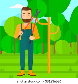 Farmer with pruner in garden.