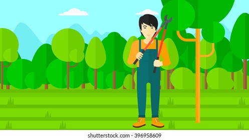 Farmer with pruner in garden.