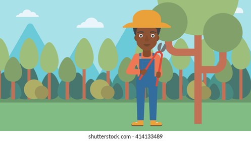 Farmer with pruner in garden.