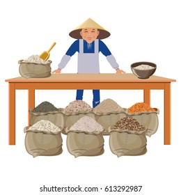 Farmer selling different kinds of rice at the local market.