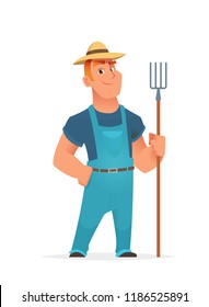 Farmer standing and holding agricultural tool or farm fork