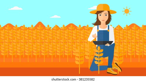 Farmer with tablet computer on field.