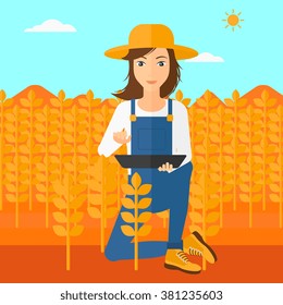 Farmer with tablet computer on field.