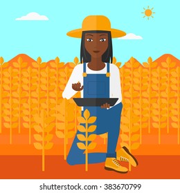 Farmer with tablet computer on field.