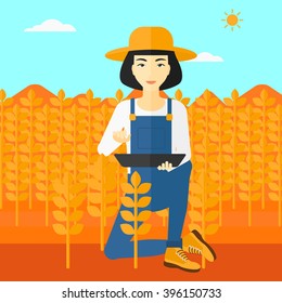 Farmer with tablet computer on field.