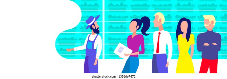 farmer in uniform with agriculture engineers group inspecting growing plants vertical farm organic hydroponic vegetables modern greenhouse interior horizontal portrait