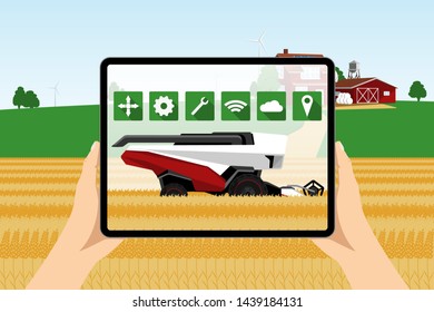 Farmer uses a digital tablet to control autonomous harvester. Smart farming concept.