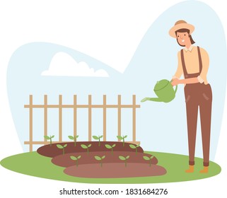 A farmer is watering his crops in the afternoon