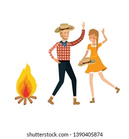 farmers couple dancing with straw hat and bonfire