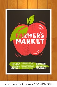 Farmer`s market- advertisement poster template. Vector colored banner on wooden background. Red decorative apple shape with green leaves and handdrawn text.Flayers, banners, commercial design.