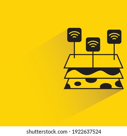 farmland and wifi sensor with shadow on yellow background