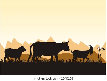farm's animal in front of the mountains