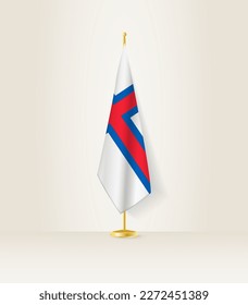 Faroe Islands flag on a flag stand. Vector illustration.