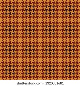 Fashion check tweed pattern in yellow, red, and burgundy. Houndstooth plaid for fabric design. Seamless tile.