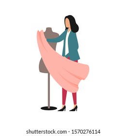 Fashion designer trying on fabric on a mannequin. Flat vector illustration. Woman holds in her hands a cut of textile for tailoring a dress. Seamstress in the atelier, workshop, sewing studio.