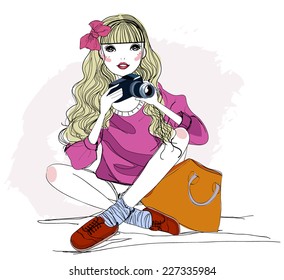 Fashion girl with camera