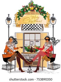 Fashion girls in the street cafe. Street cafe with flowers in the old city. 
