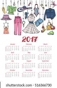 Fashion illustration.Calendar 2017 new year.Vector hand drawn  fashionable women  clothes and accessories hanging on rope.Background, design template.Summer vacation wear