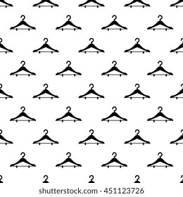 Fashion modern seamless pattern with clothes hangers isolated on white. Vector rack background.