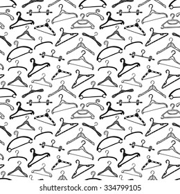 Fashion Modern Seamless Pattern With Doodle Clothes Hangers. Vector Background.