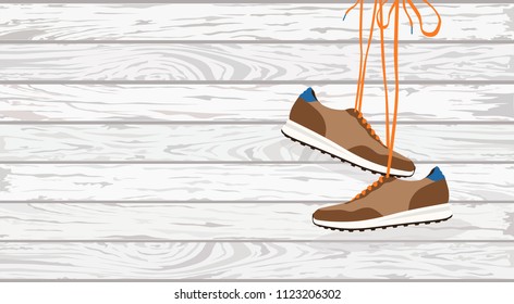 Fashion pair of hanging shoes on white background