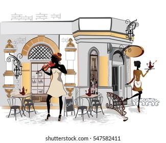 Fashion people in the restaurant. Street cafe in the old city. Waiters serve the tables. Musicians.