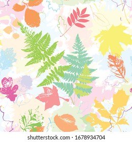 Fashion seamless pattern. Multi-colored forest leaves on a bon of pale colored blots. Concept for wallpaper, textile, fabric, stickers, scrapbooking, wrapping paper, baby clothes or bedding, surface p