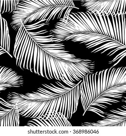 Fashion tropical seamless pattern. Black and white palm leaves. Modern trendy endless background. Vector.