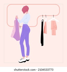 Fashion women selects brand clothes in boutique, shop.Fashion red hair girl back.Stylish women in striped trousers.Stylish girl choose new look.Sport girl try pink jacket on.Fashion model buys clothes