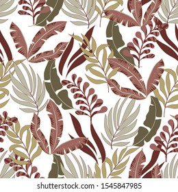 Fashionable abstract seamless tropical pattern in bright colors on a light background. Exotic tropics. Summer. Printing and textiles. Seamless pattern with colorful leaves and plants.