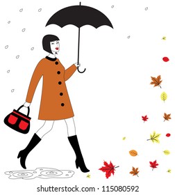 Fashionable beautiful happy woman with umbrella walking in the rain. Autumn leaves falling in the wind