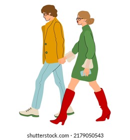 Fashionable Couple Walking The Street Holding Hands. Fancy Dressed Man And Woman Strolling The City. Young People On A Date.