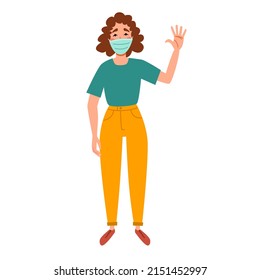A fashionable girl in a medical mask greets. Friendly greeting of a young woman.