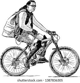 A fashionable guy rides a bicycle